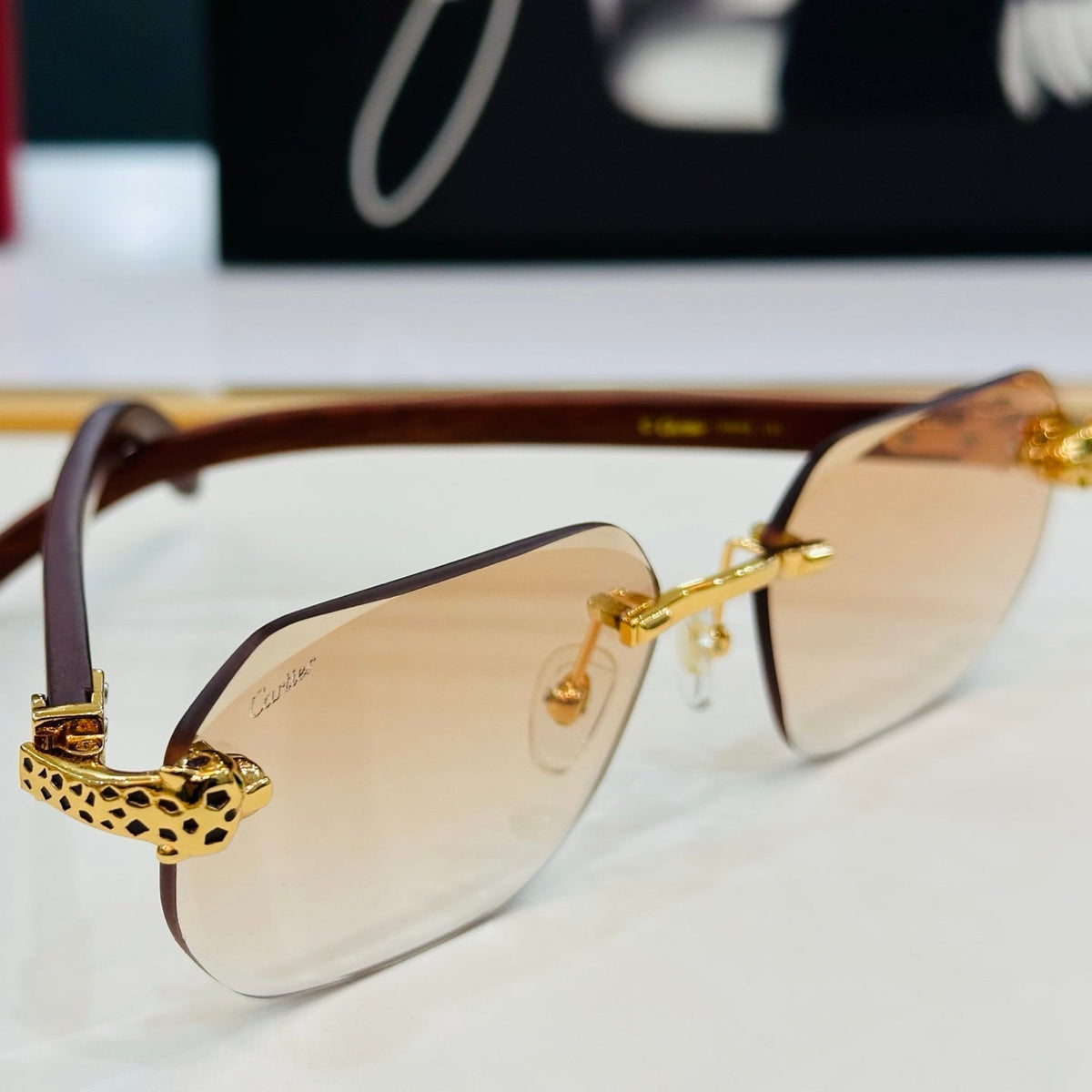 CARTIER PANTHÈRE RIMLESS OVAL FRAME SUNGLASSES  543637 IN METAL